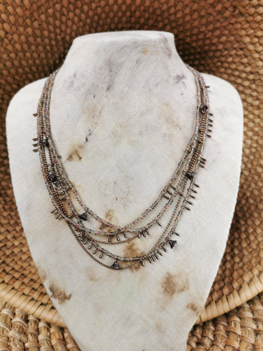 dainty seed bead multilayer necklace on a jewelry stove