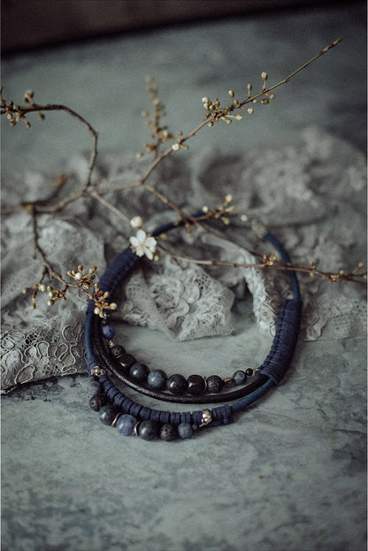 Bead and leather bib necklace