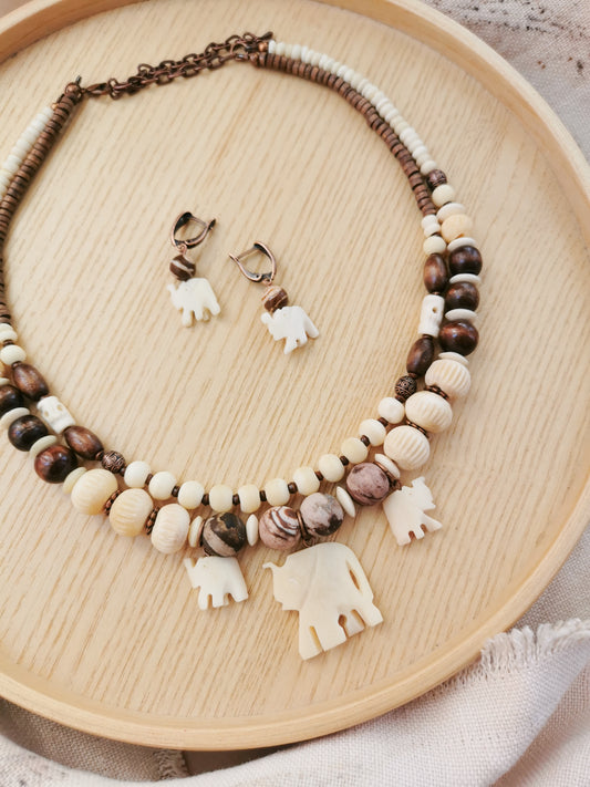 Bone bead jewelry set with elephant charms.