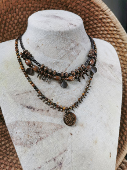 boho rustic jewlery set with brown beads and metal elements on a mannequin bust.