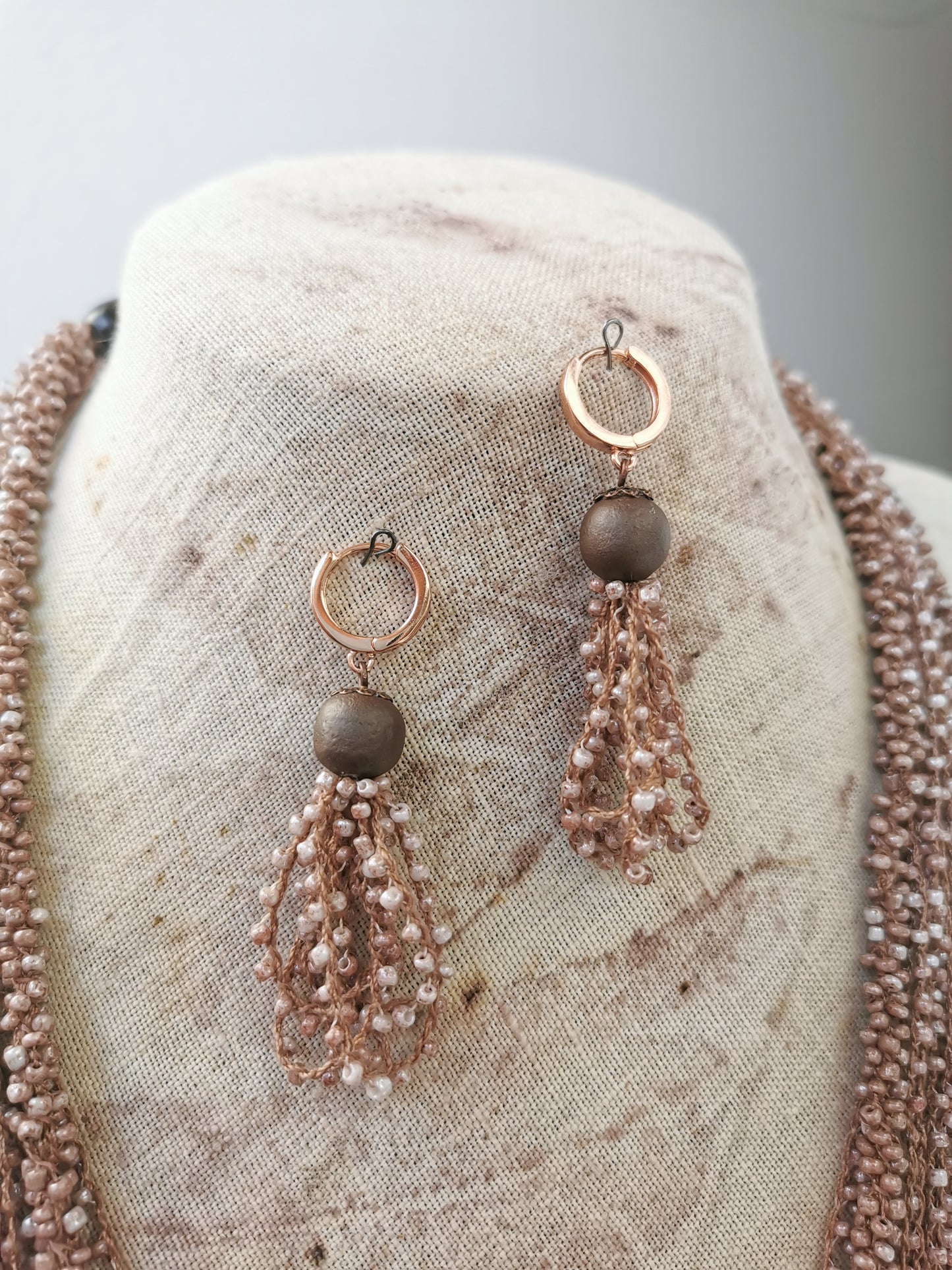close up photo of beige jewelry set