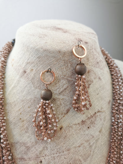 close up photo of beige jewelry set