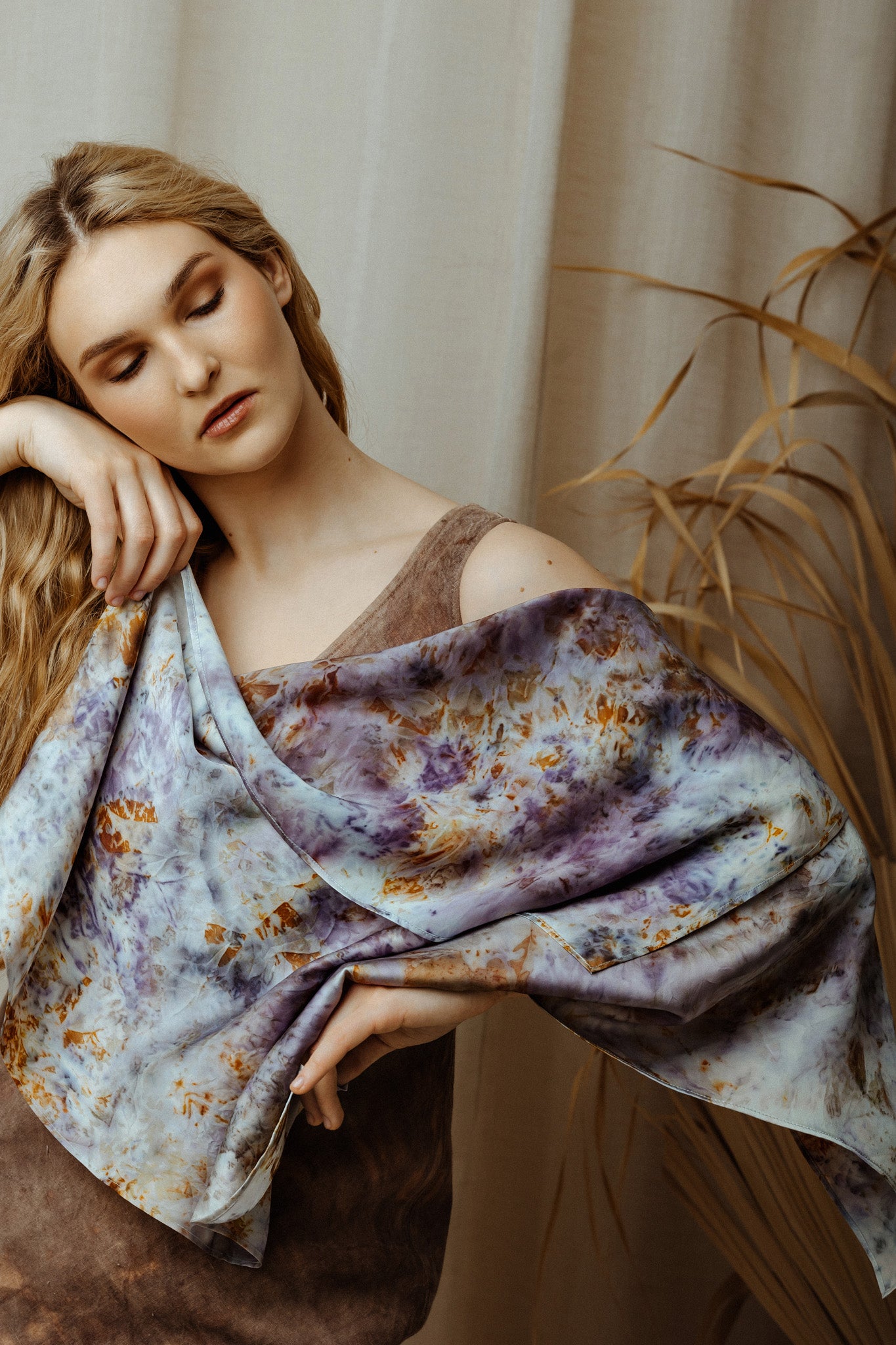 women holding colourful botanical dye silk scarf