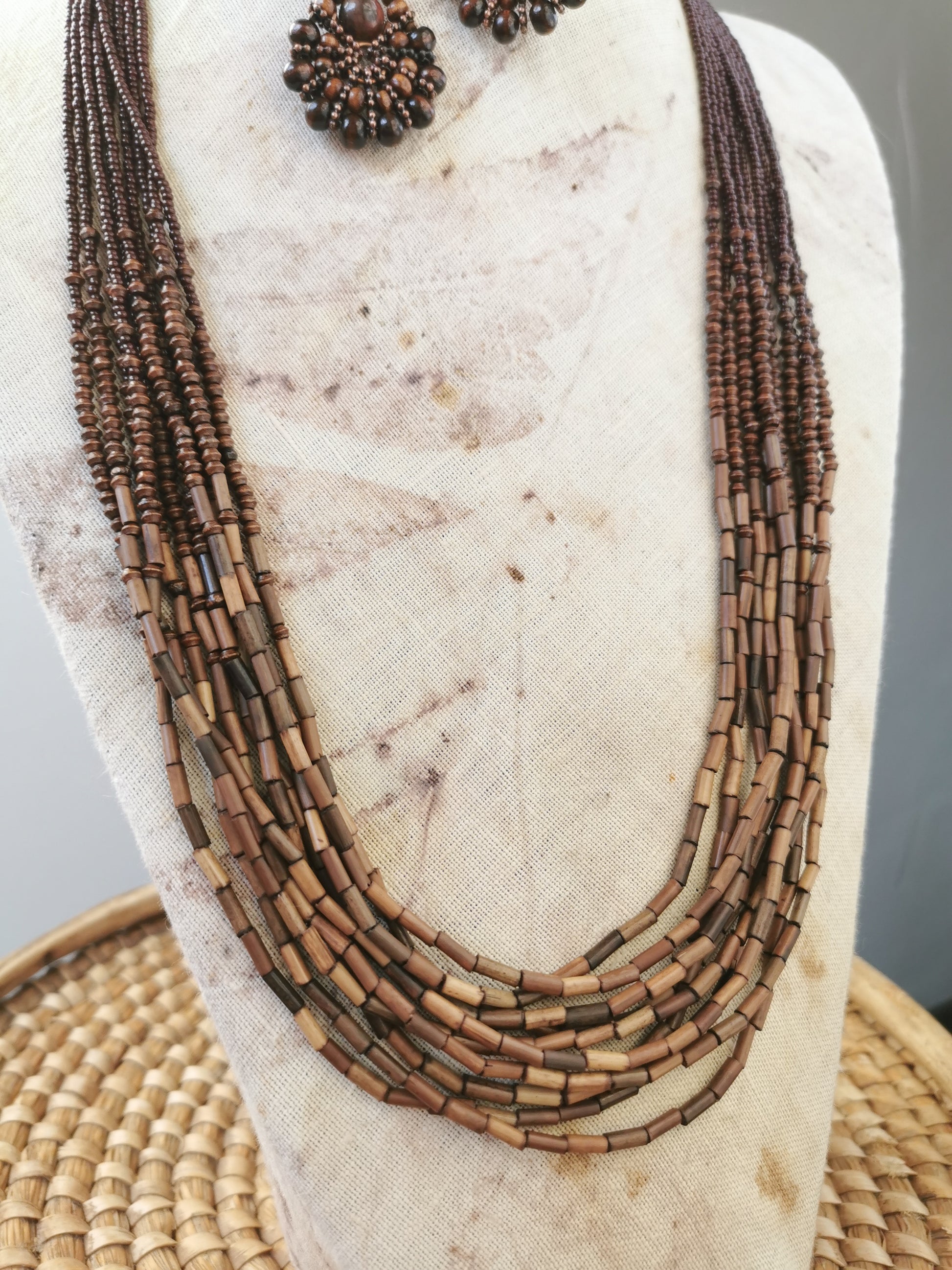 close up photo of long boho bead layering necklace