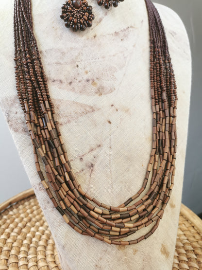 close up photo of long boho bead layering necklace