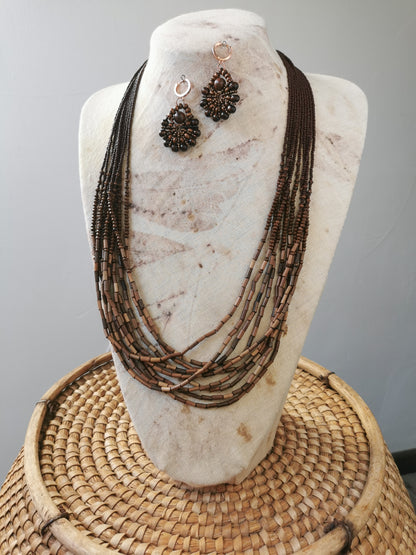 long boho bead layering necklace and earrings set on a display