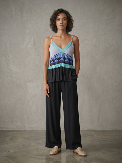 women wearing mint silk strap blouse 