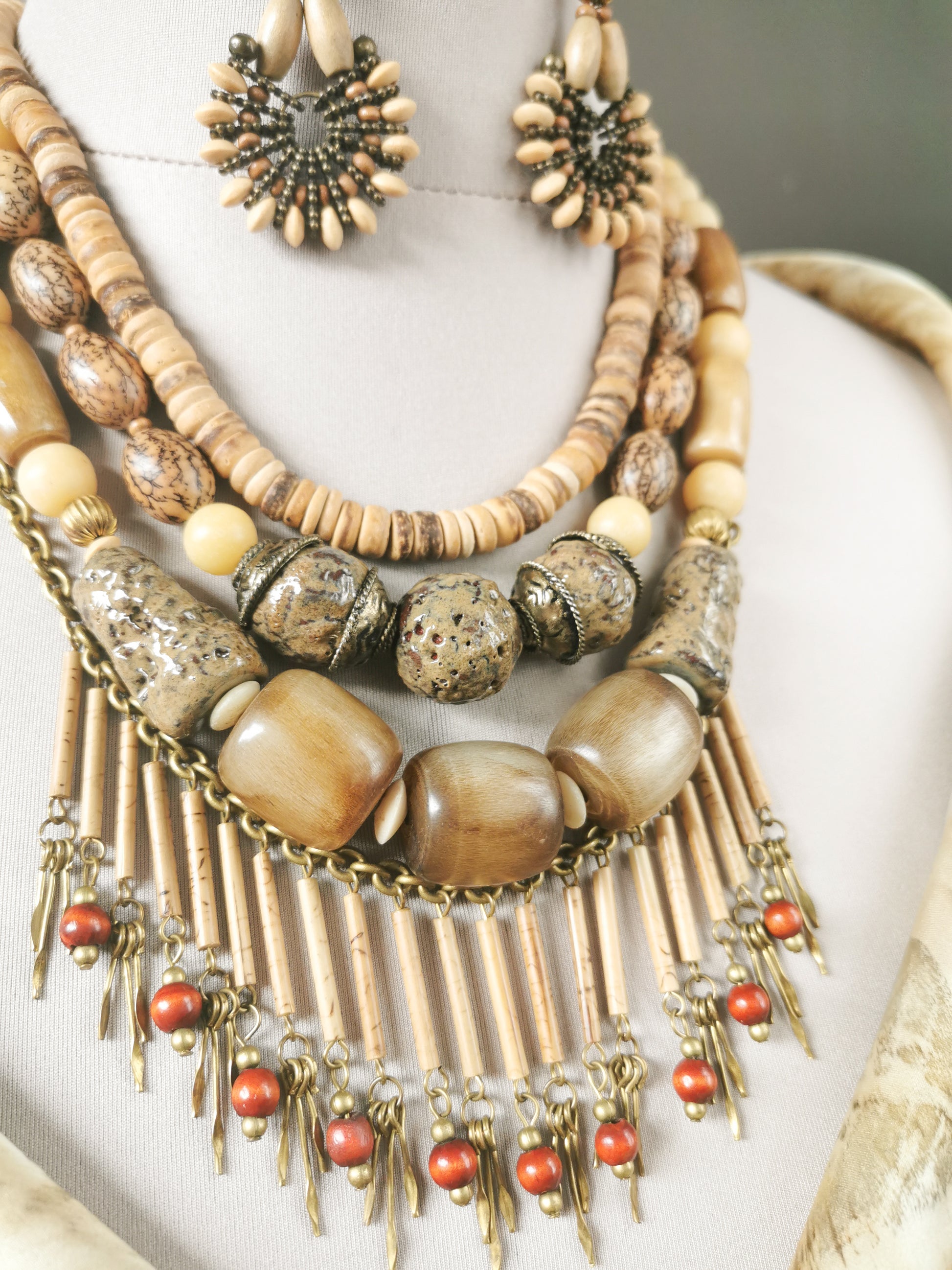 Necklace with beads and fringes on a mannequin