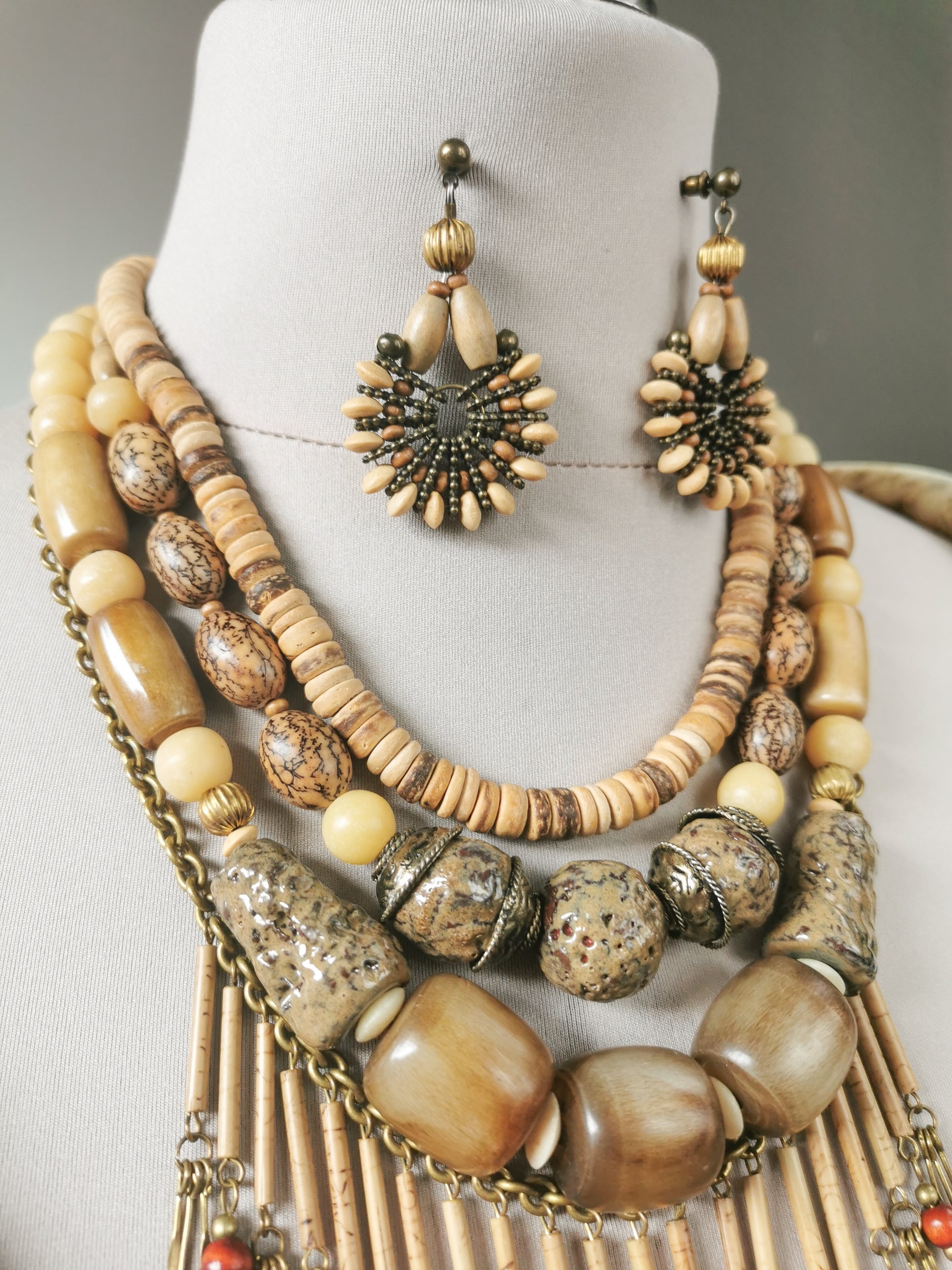 Jewelry set with necklace and earrings on a mannequin bust