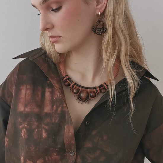 model wearing boho leather cord and bead necklace