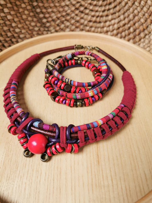 Colorful necklace and bracelet set on a wooden surface