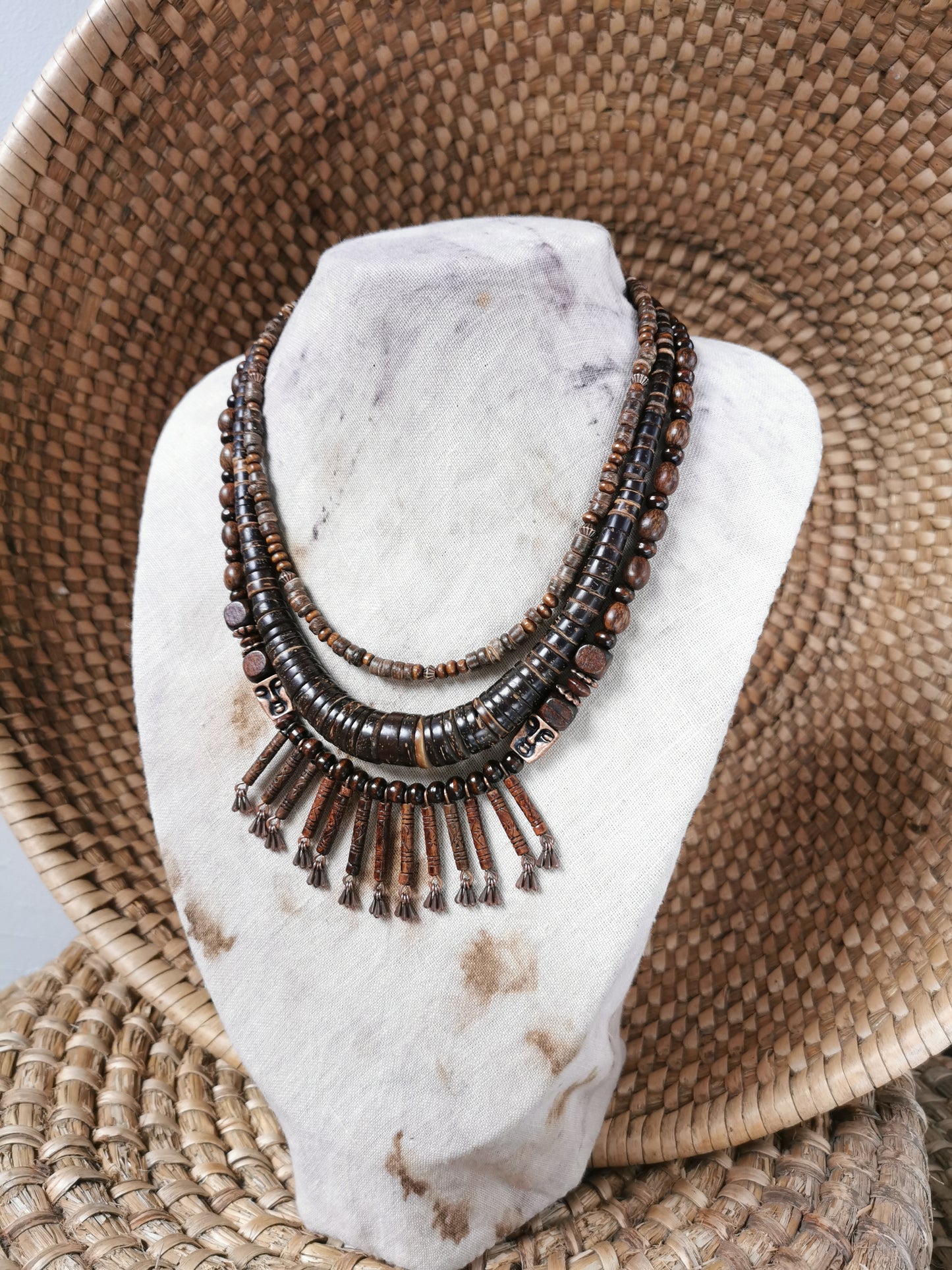 Necklace with beads on a white stone surface