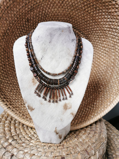 Necklace on a marble stand with a woven basket background