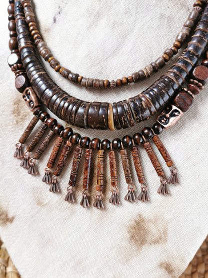 Beaded necklace with tassels on a textured surface