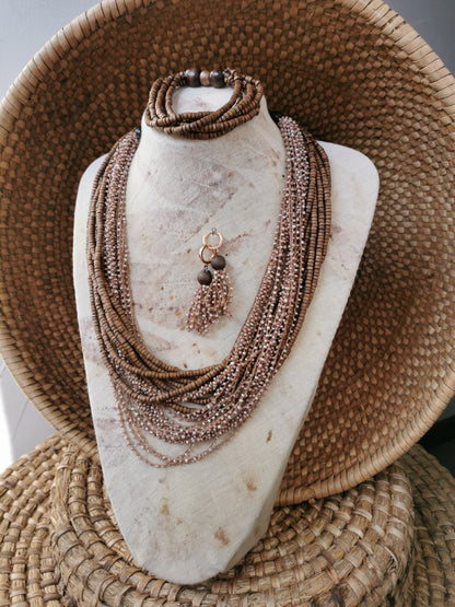 Necklace set on a mannequin bust with woven background